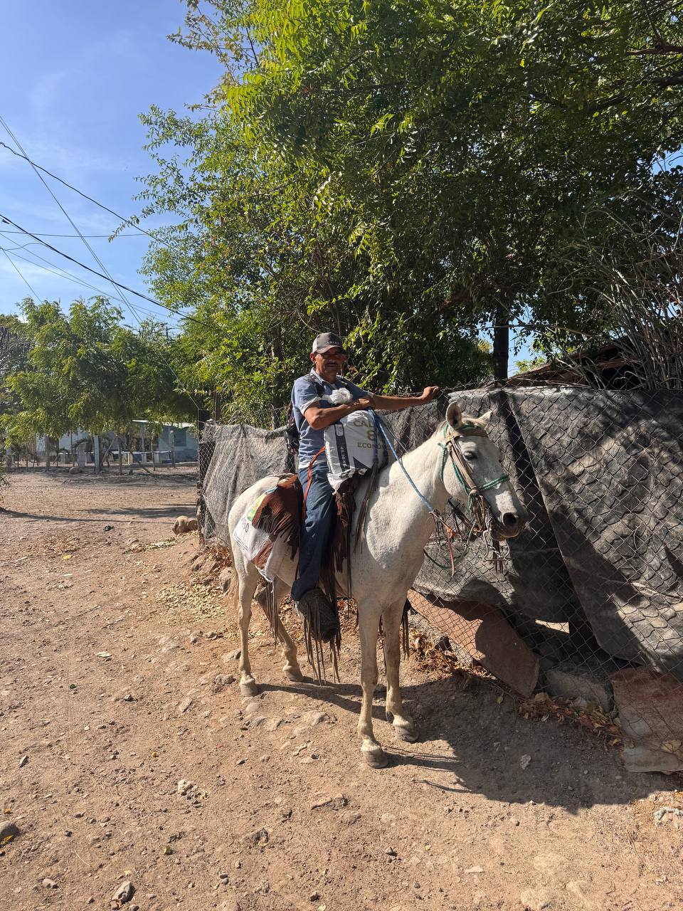 A man traveling on horseback in a rural community in Nicaragua