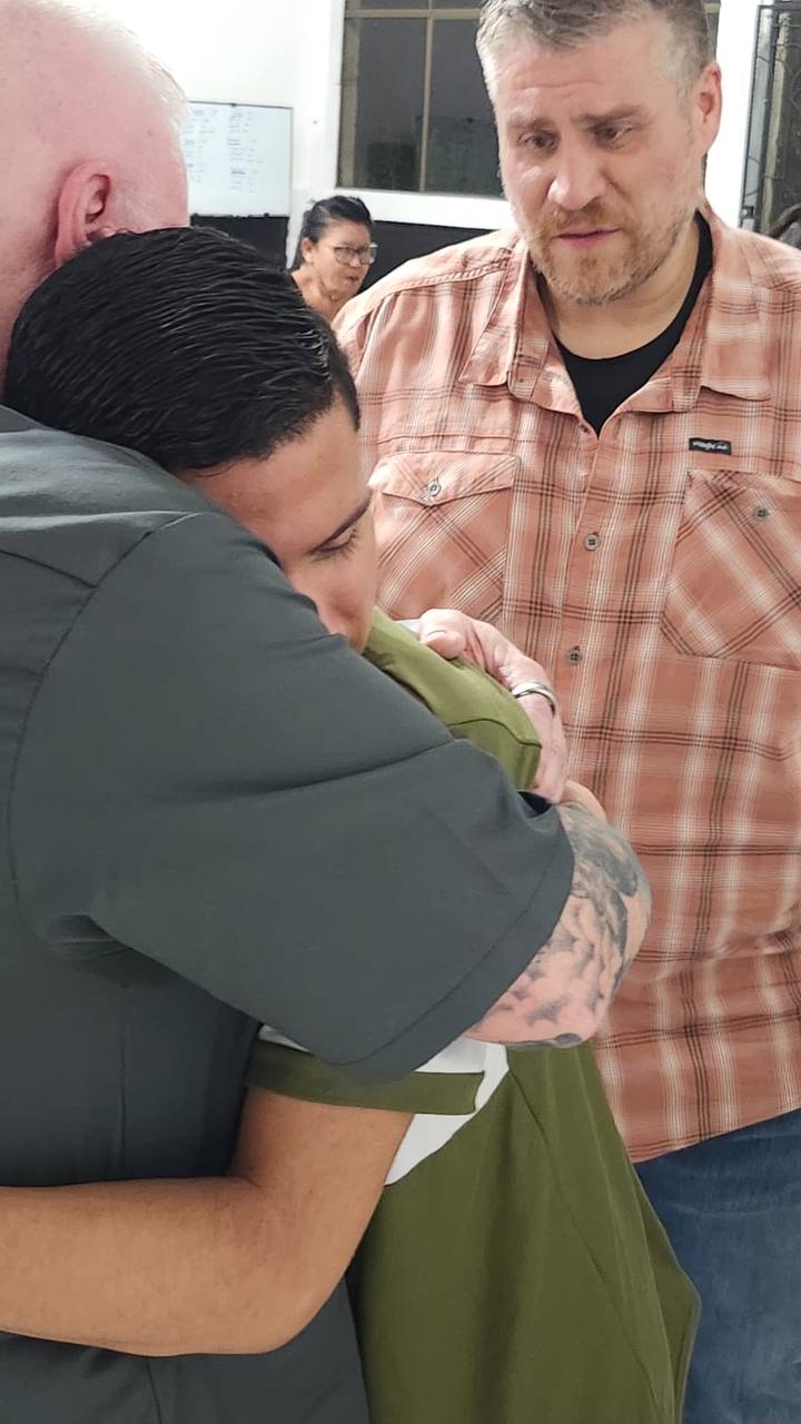 Pastor Michael Chamberlain praying for a person during ministry in Nicaragua